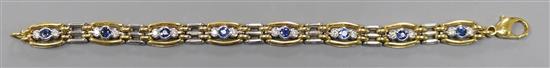 A modern 18ct two colour gold, sapphire and diamond set bracelet, gross 31.2 grams.